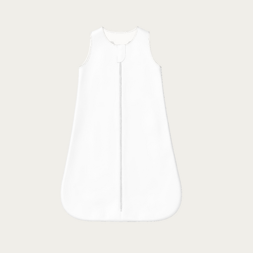 Flat lay of the white baby sleep sack showing the plain front panel with zipper and protective zipper cover.