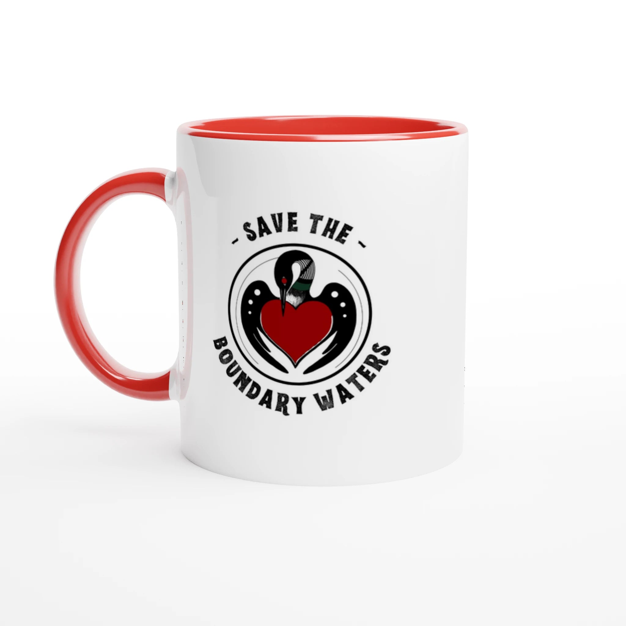 Ceramic mug with clean loon emblem, red colored rim and handle, set to the left.