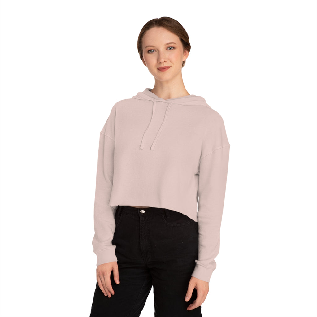 Model wearing blush cropped hoodie, front view, showing relaxed fit, adjustable hood, and ribbed cuffs.