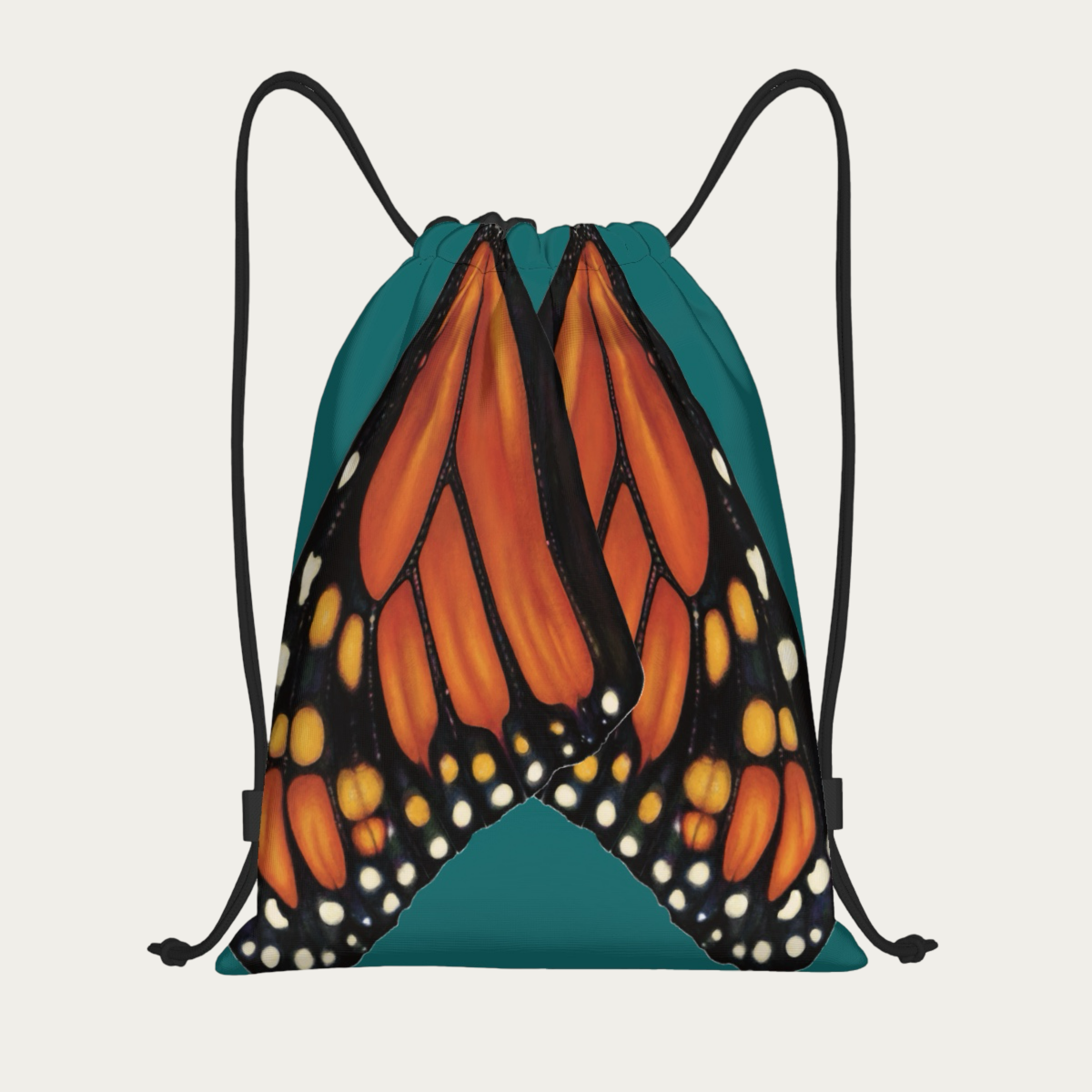 Floating view of jade‑green drawstring backpack with monarch butterfly wings printed in natural alignment across the back.