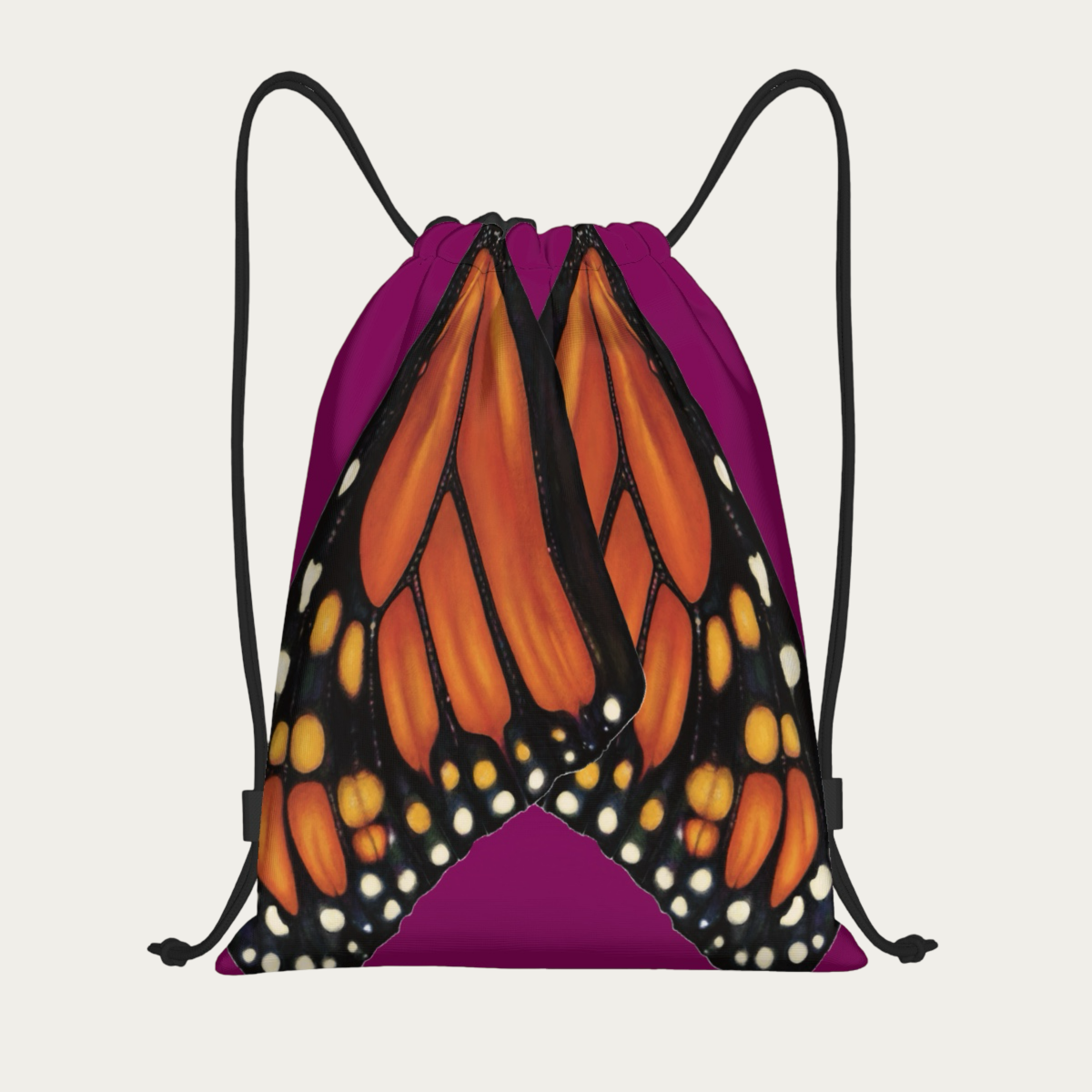 Floating view of plum drawstring backpack with monarch butterfly wings printed in natural alignment across the back.