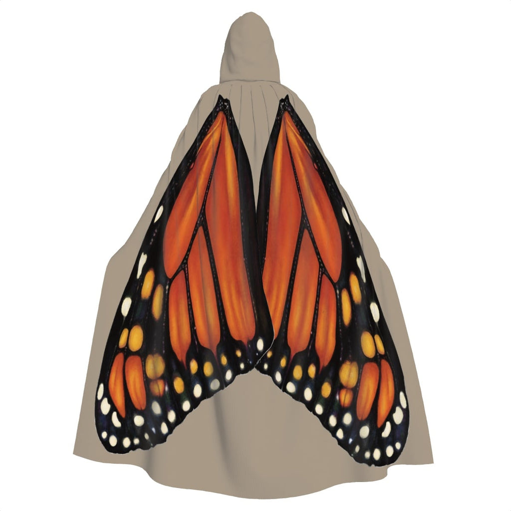 Model standing with back facing camera wearing sand hooded cape showing monarch butterfly wings spread wide across the back.
