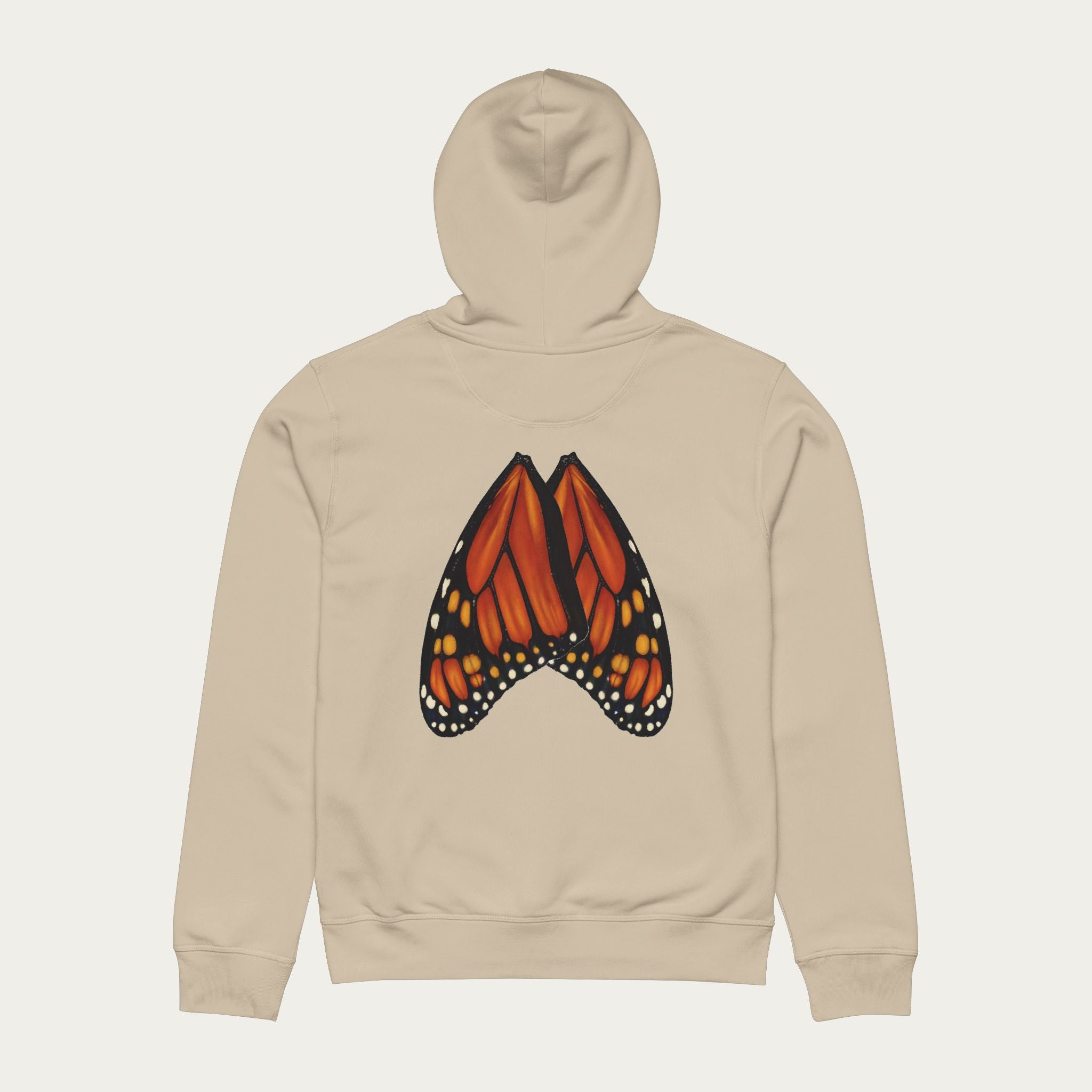 Flat lay of desert dust hoodie with monarch butterfly wings printed in natural wing alignment across the back.