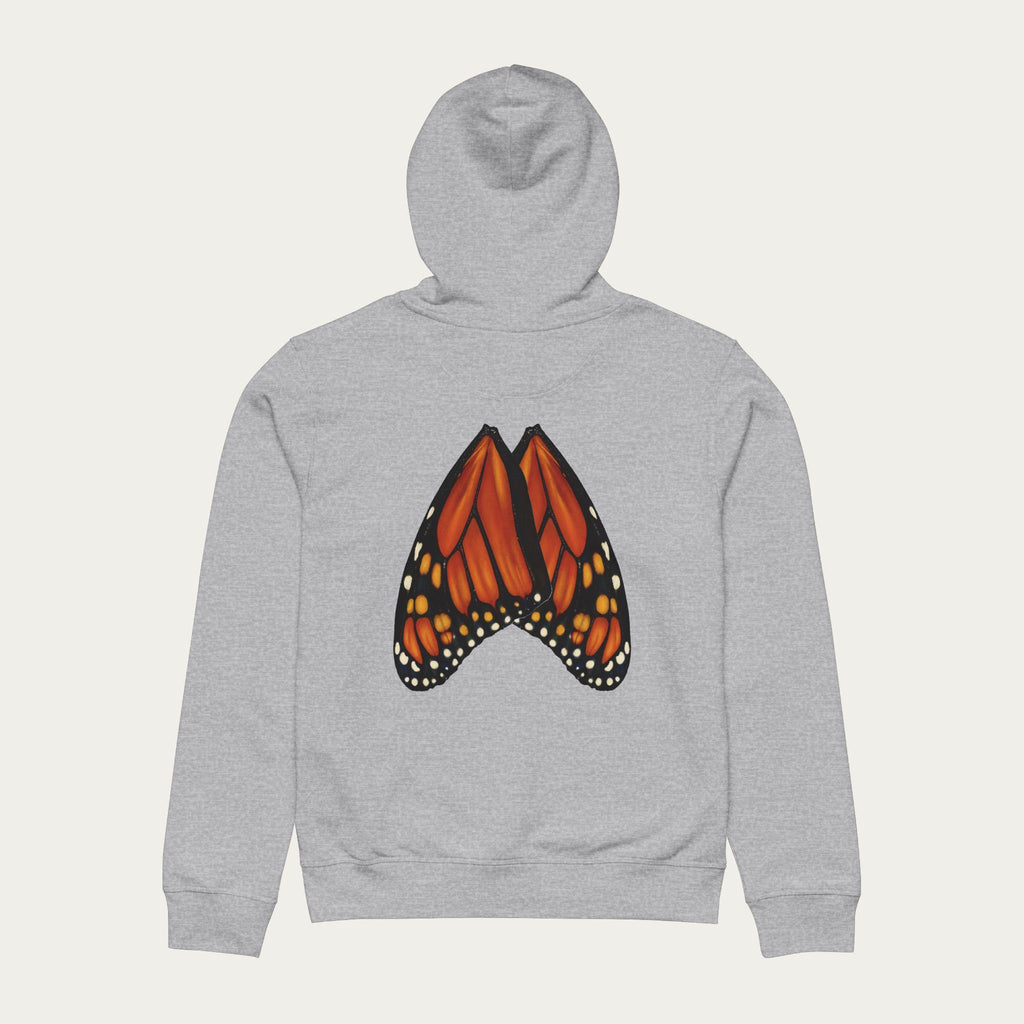 Flat lay of heather grey hoodie featuring monarch butterfly wings printed across the back in full detail.