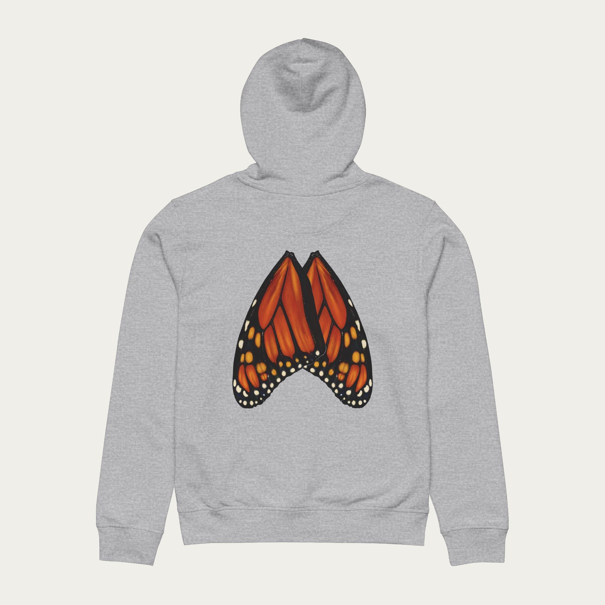 Flat lay of heather grey hoodie featuring monarch butterfly wings printed across the back in full detail.