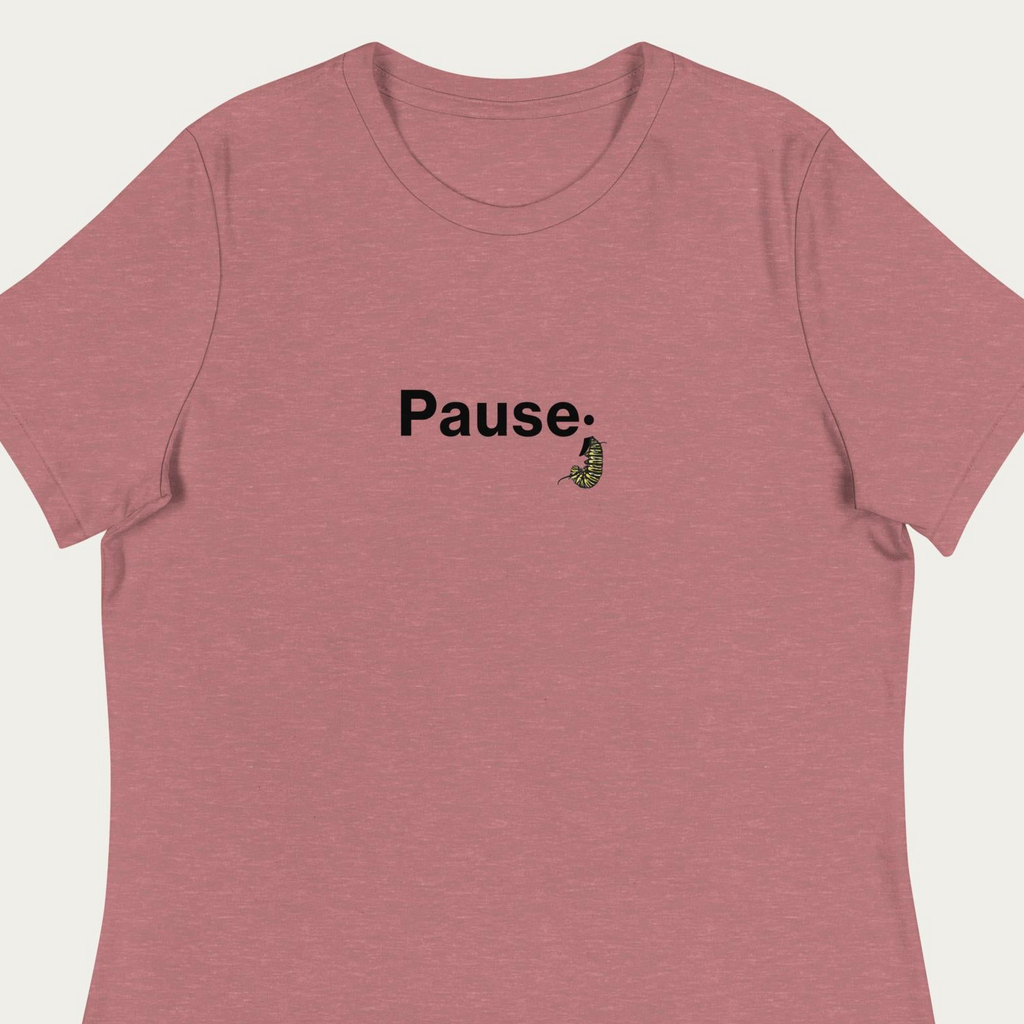 Close‑up crop of heather mauve t‑shirt showing detailed monarch caterpillar illustration forming the semicolon in the “Pause;” graphic.