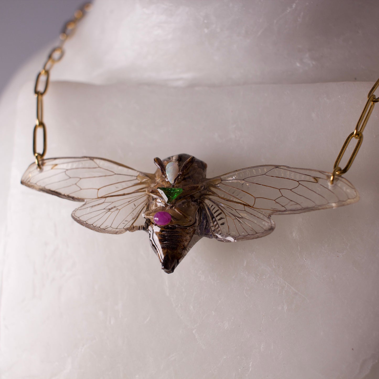 Real cicada necklace Dog Day Cicadas gold paperclip chain opal emerald pink ruby close up on wax