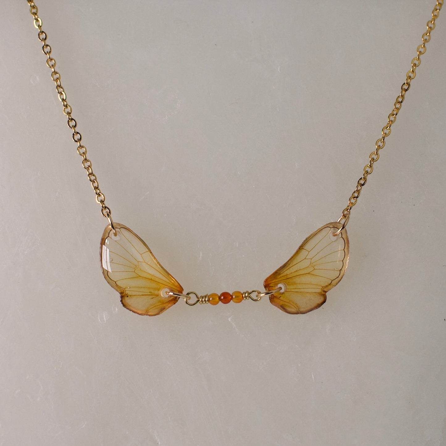 Real cicada wing necklace brood cicadas fire agate gold chain close up