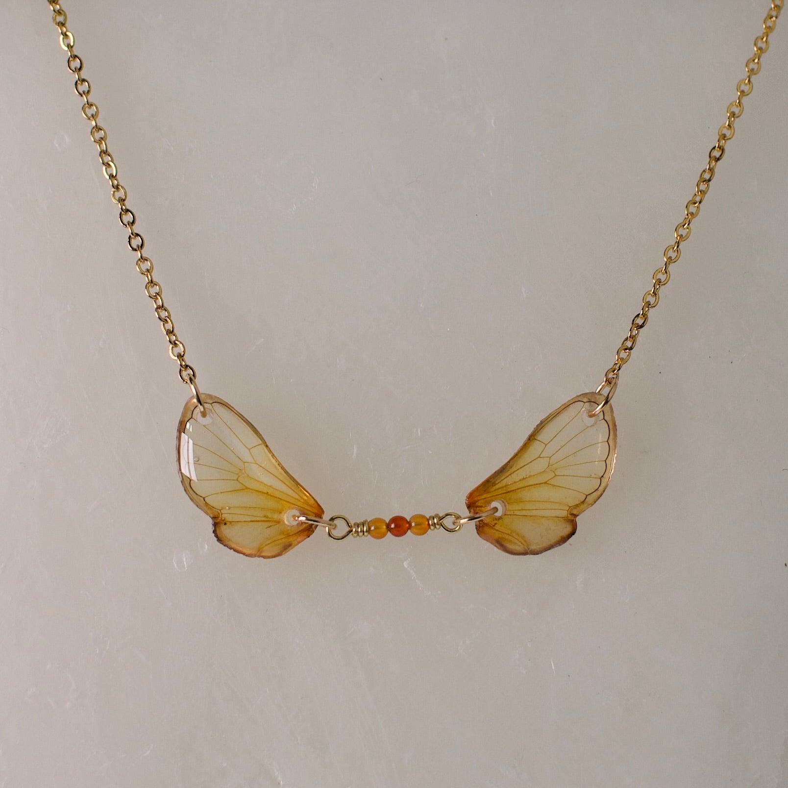 Real cicada wing necklace brood cicadas fire agate gold chain close up