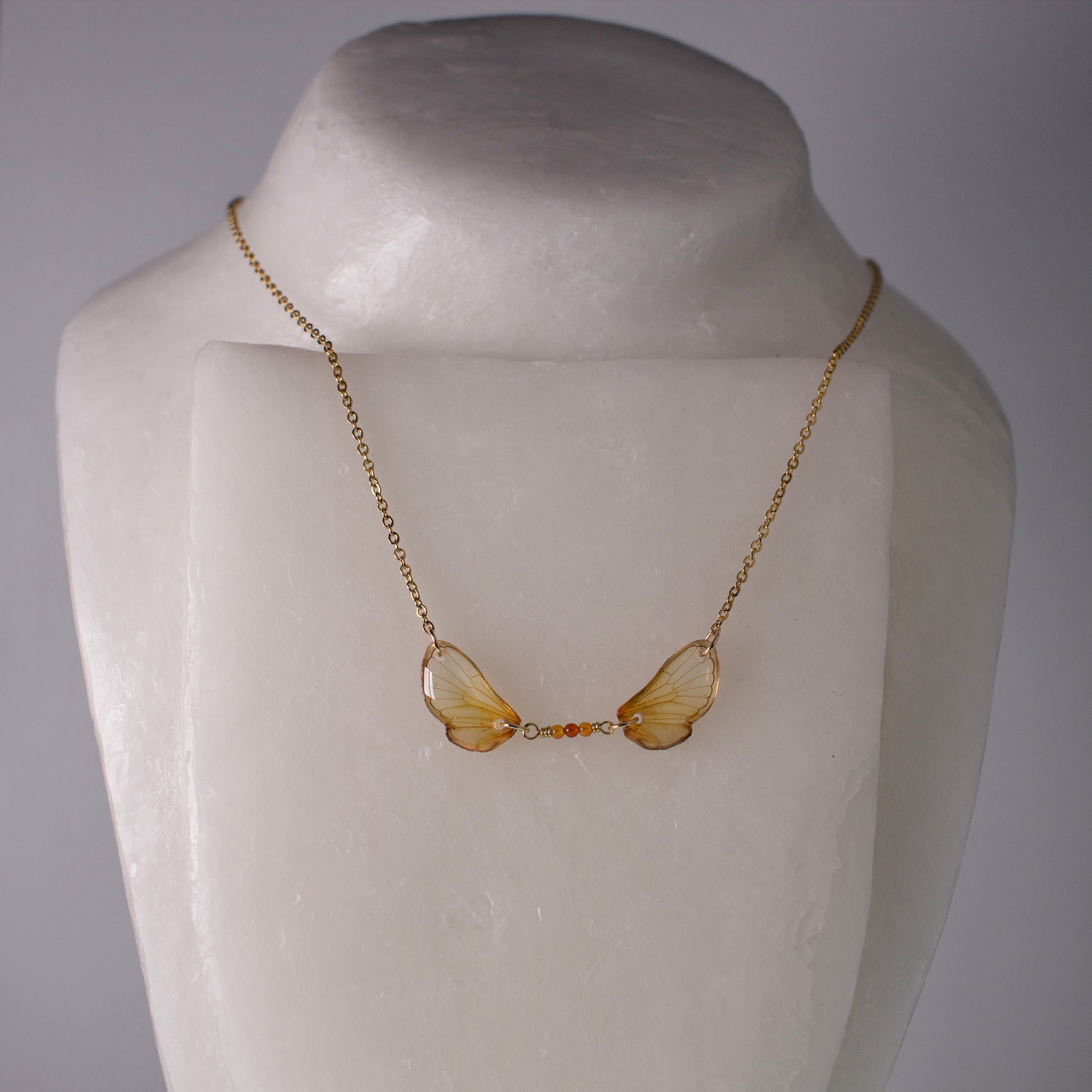 Real cicada wing necklace brood cicadas fire agate gold on mannequin