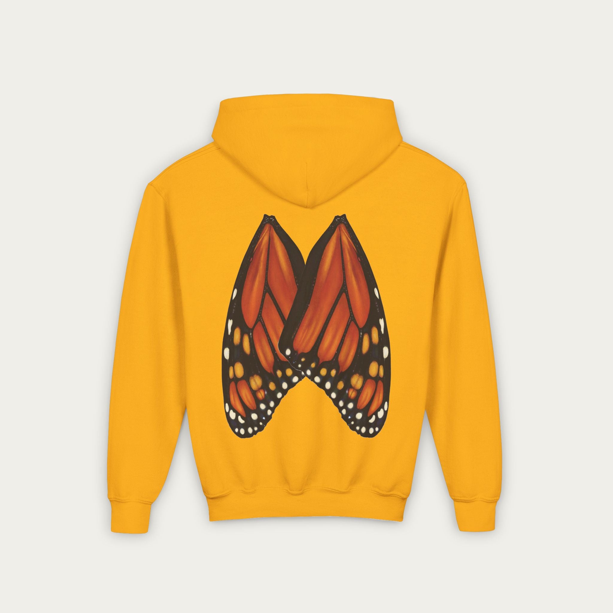 yellow kids hoodie with conservation artist illustrated monarch butterfly wings on back flat lay view white background