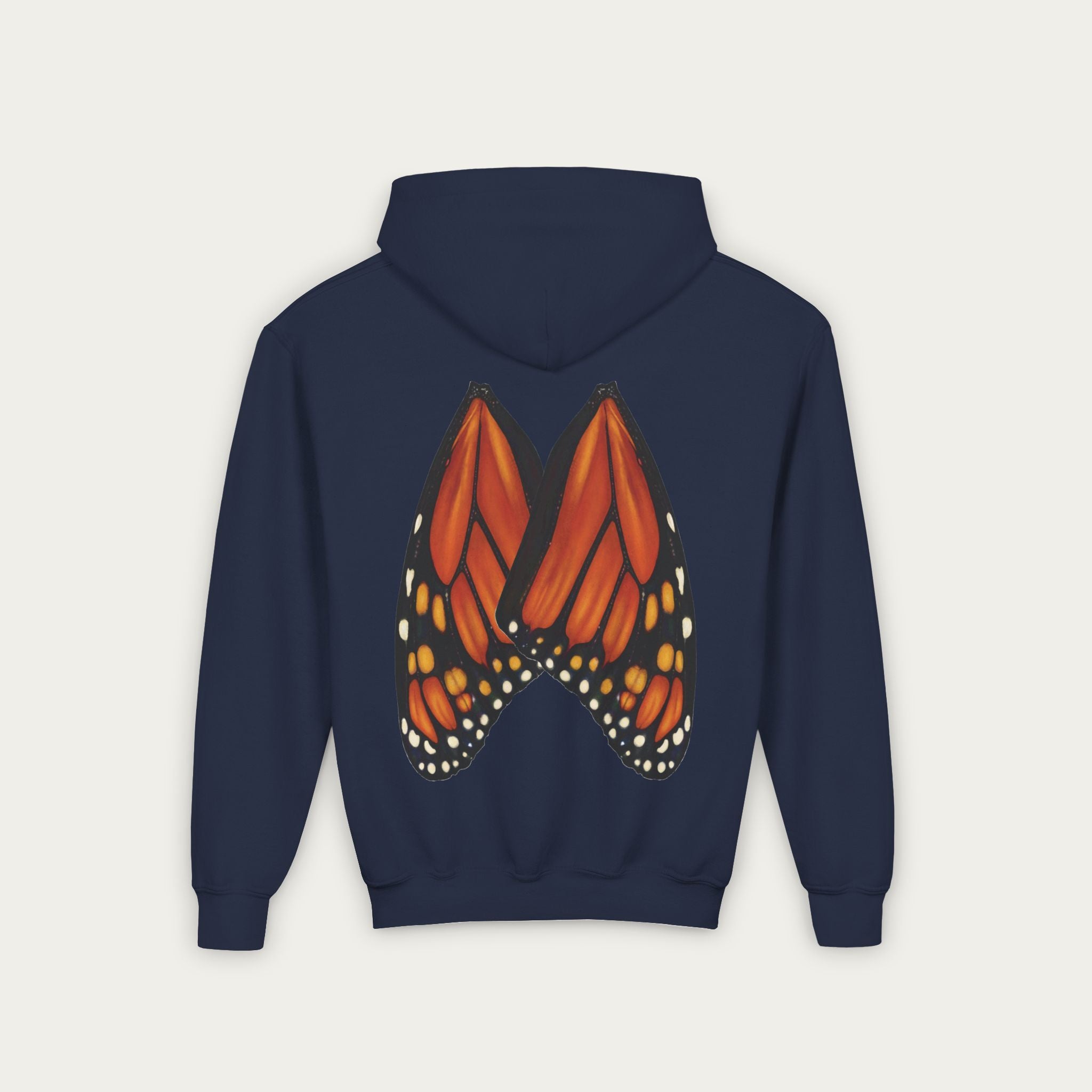 Navy blue kids hoodie with conservation artist illustrated monarch butterfly wings on back flat lay view white background