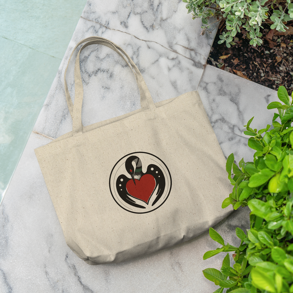 minnesota-circle-loon-emblem-mn-artist-drawn-cotton-canvas-tote-grocery-size-on-marble-bench