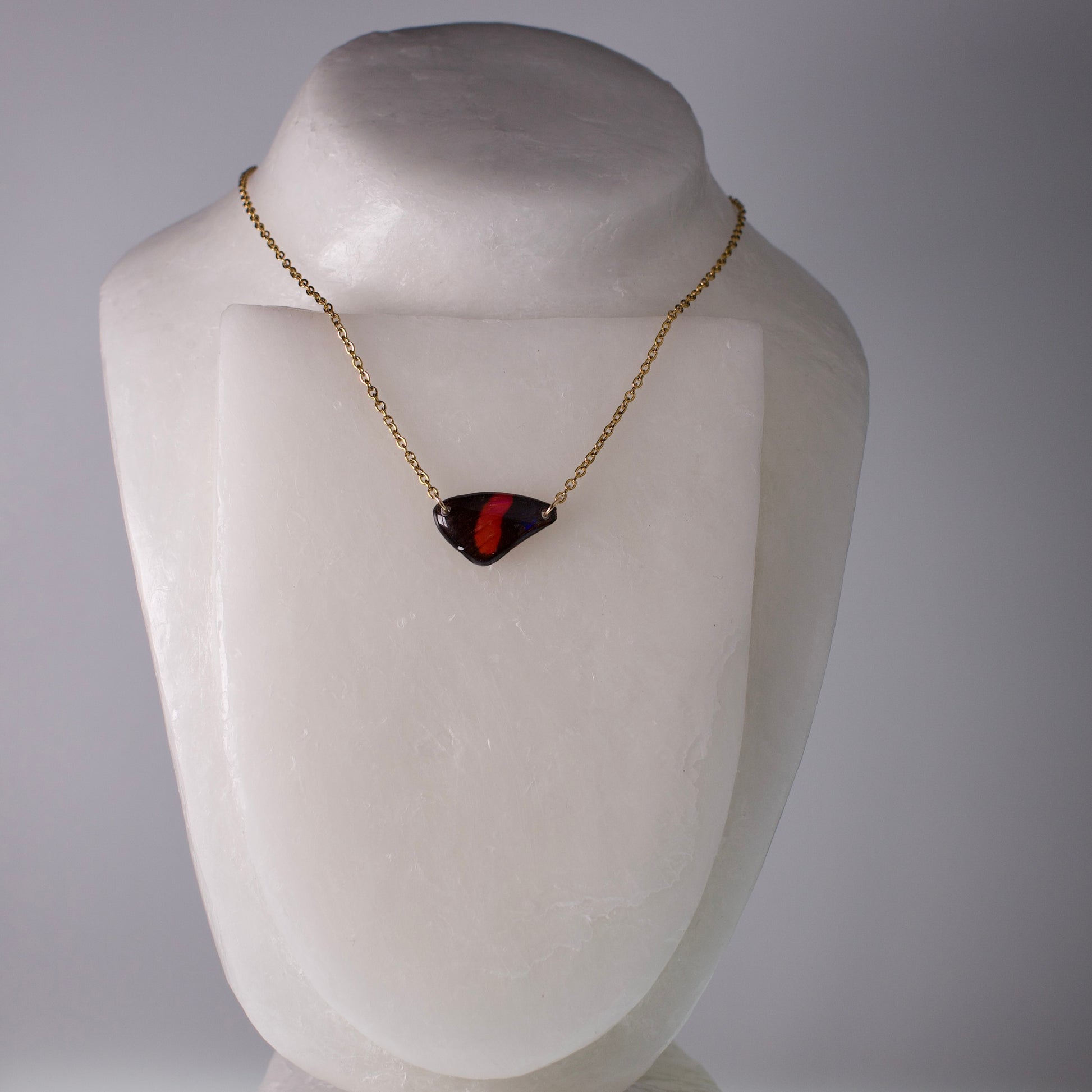 real butterfly necklace red black butterflies gold chain on wax neck form