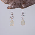 real butterfly wing earrings Falcate orange tip butterflies sterling silver geometric swirl earring on wood stand