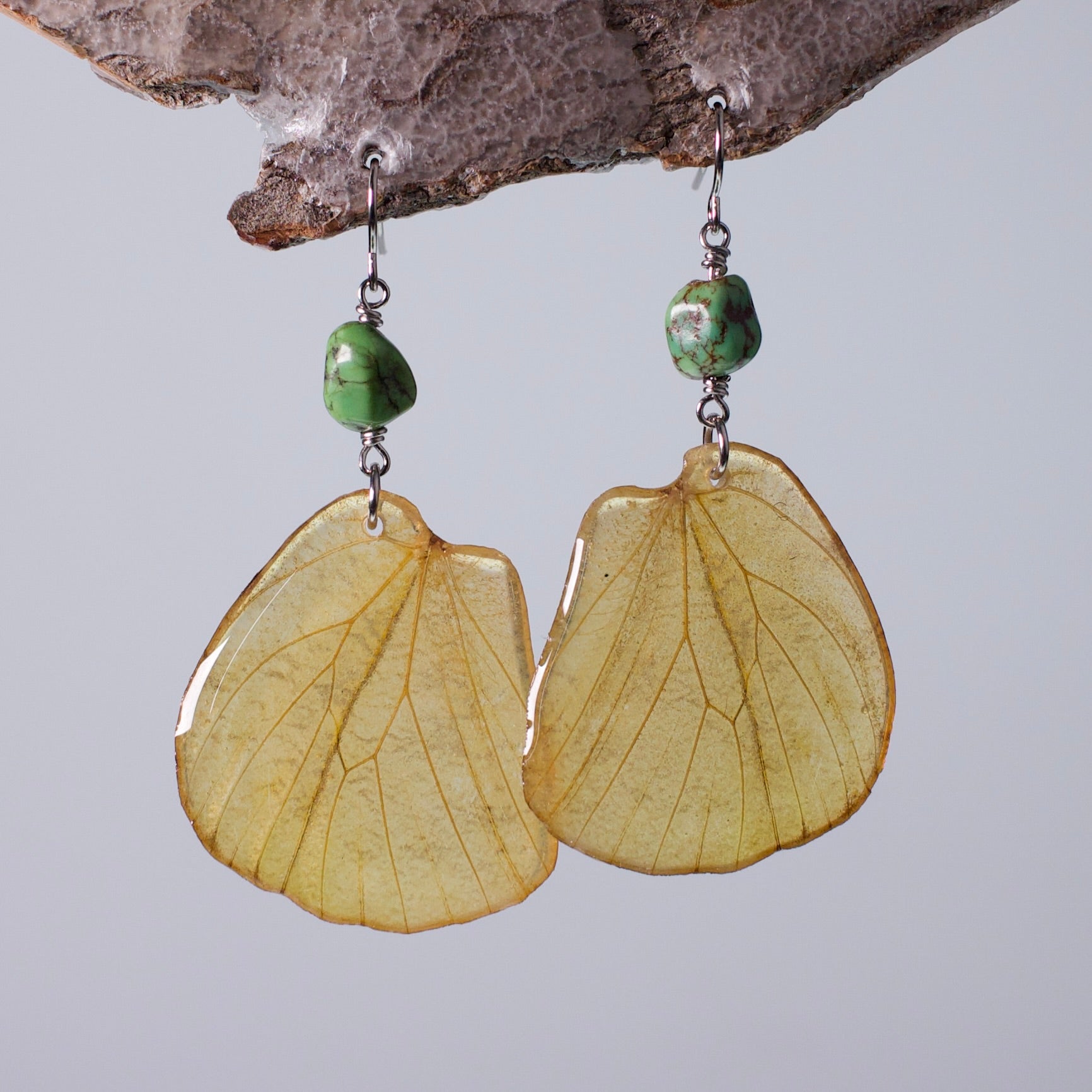 real butterfly wing earrings great orange tip butterflies gaspeite surgical steel French wire earring on wood stand