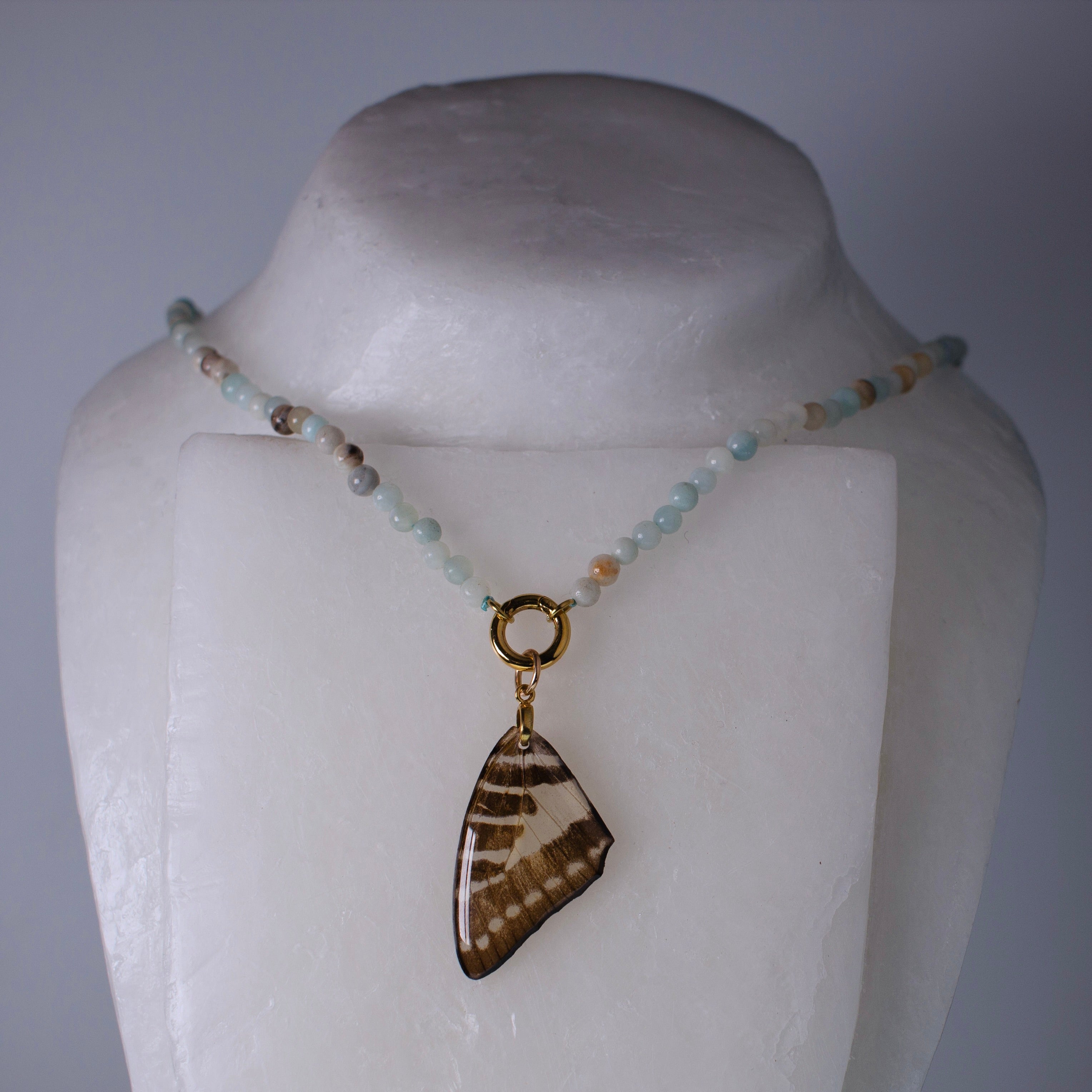 real butterfly wing necklace blue beaded gold front clasp on wax form