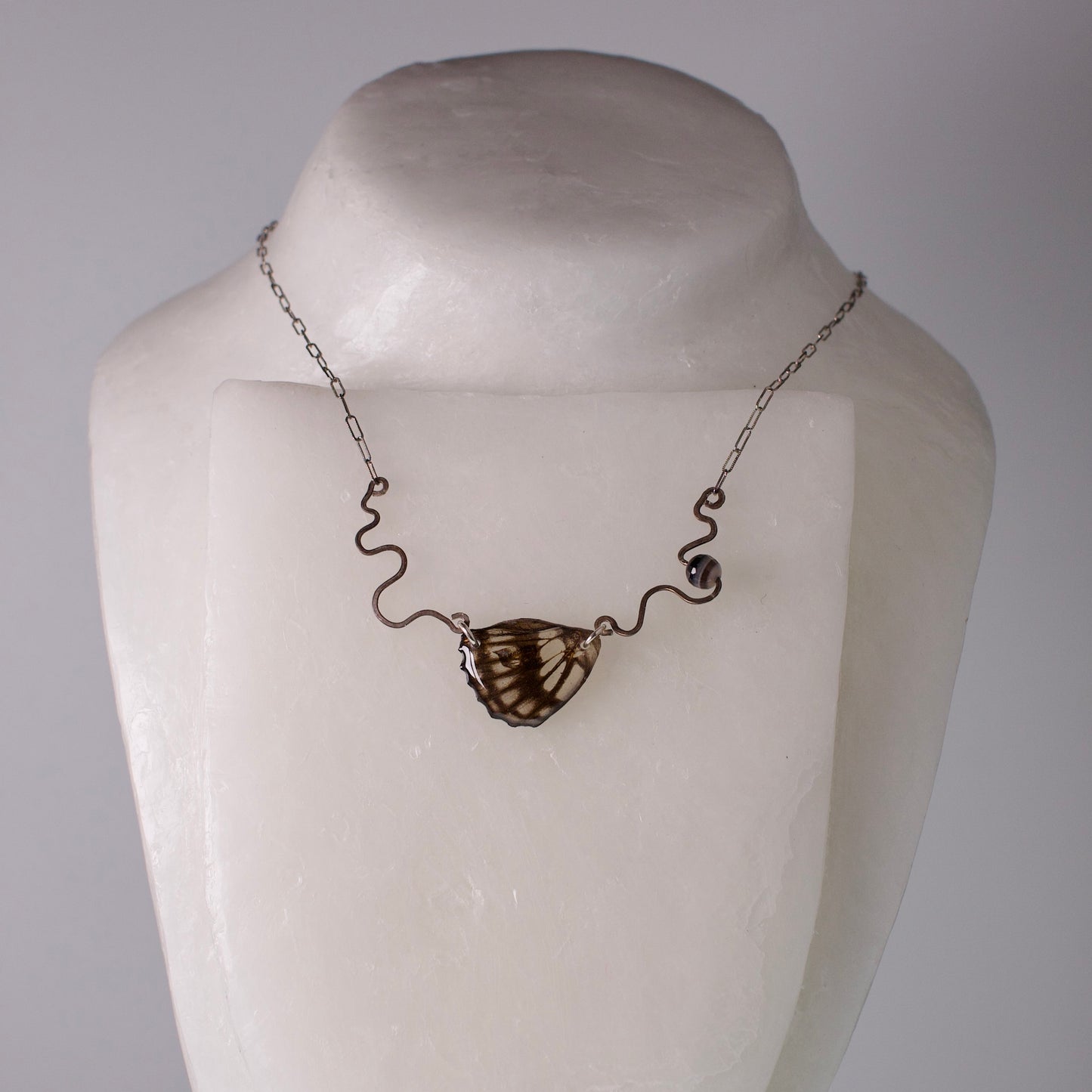 real butterfly wing necklace common sailor butterflies hand forged sterling silver banded agate on mannequin