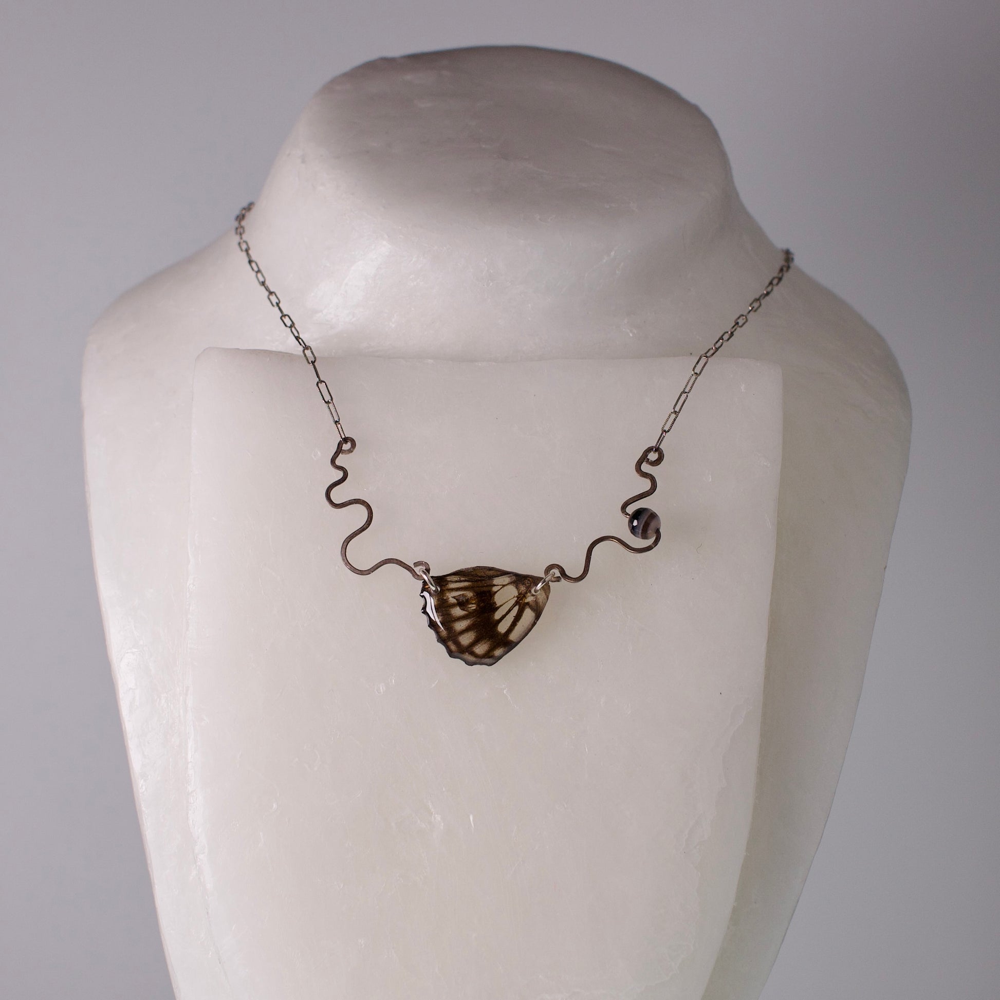 real butterfly wing necklace common sailor butterflies hand forged sterling silver banded agate on mannequin