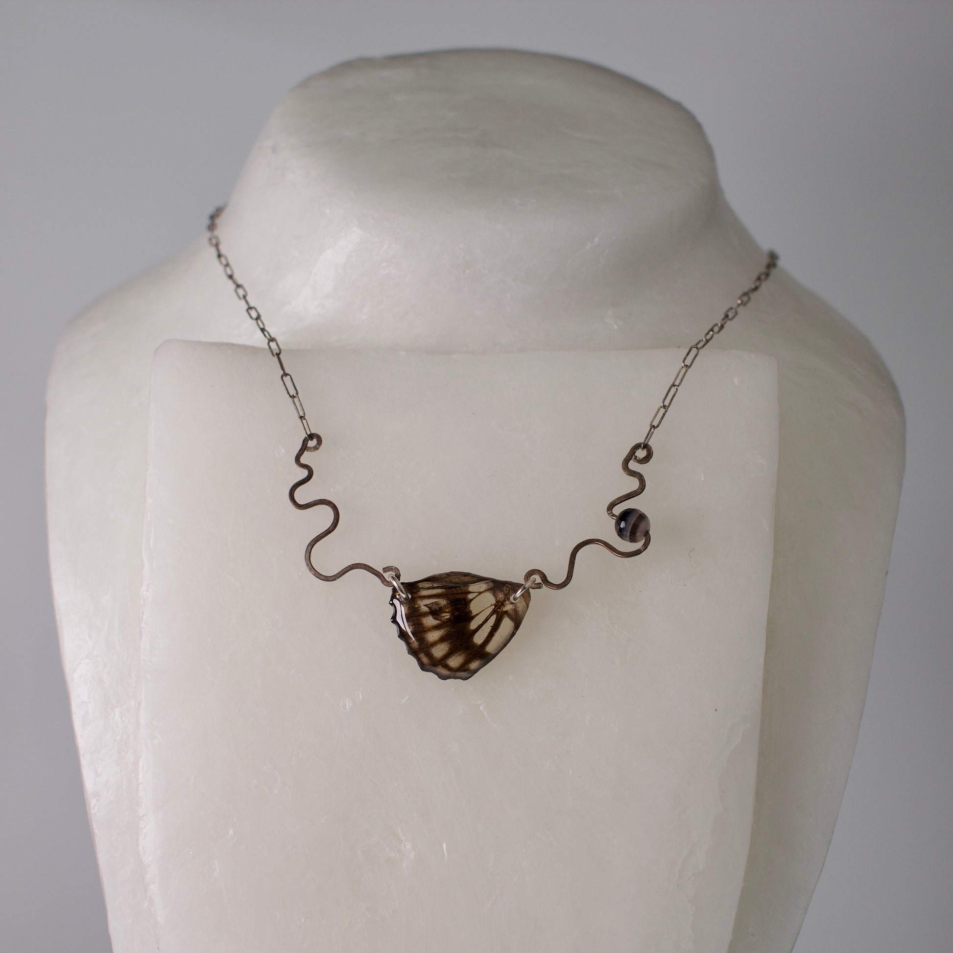 real butterfly wing necklace common sailor butterflies hand forged sterling silver stamped chain banded agate on mannequin
