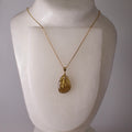 real butterfly wing necklace gold chain necklace leaf detail green veined butterflies on mannequin