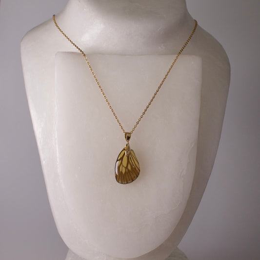 real butterfly wing necklace gold chain necklace leaf detail green veined butterflies on mannequin