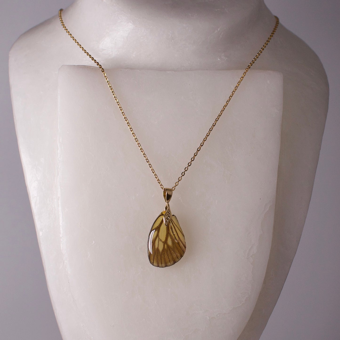 real butterfly wing necklace green veined butterflies gold chain necklace leaf detail on mannequin