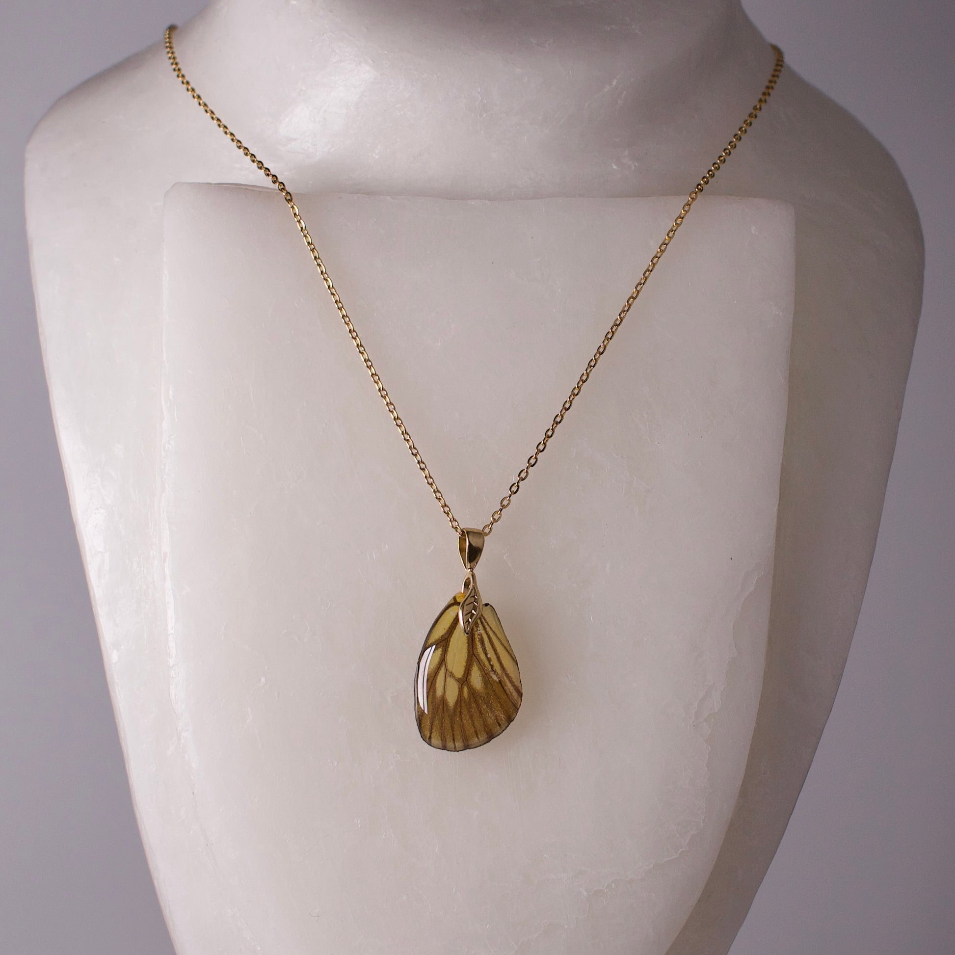 real butterfly wing necklace green veined butterflies gold chain necklace leaf detail on mannequin