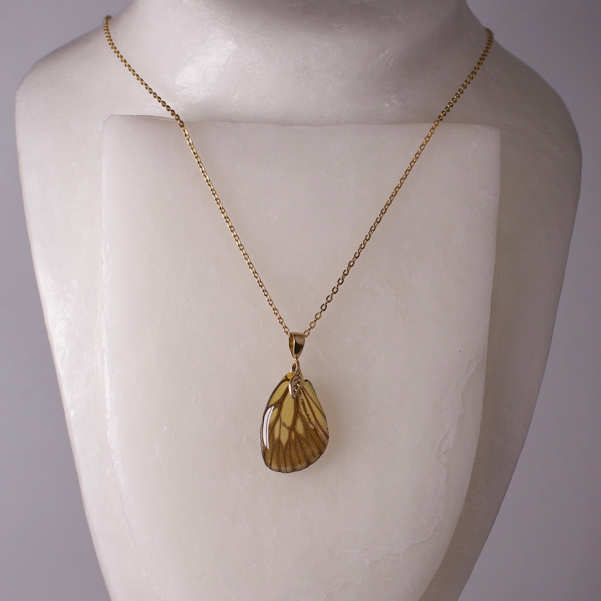 real butterfly wing necklace green veined butterflies gold chain necklace leaf detail on mannequin