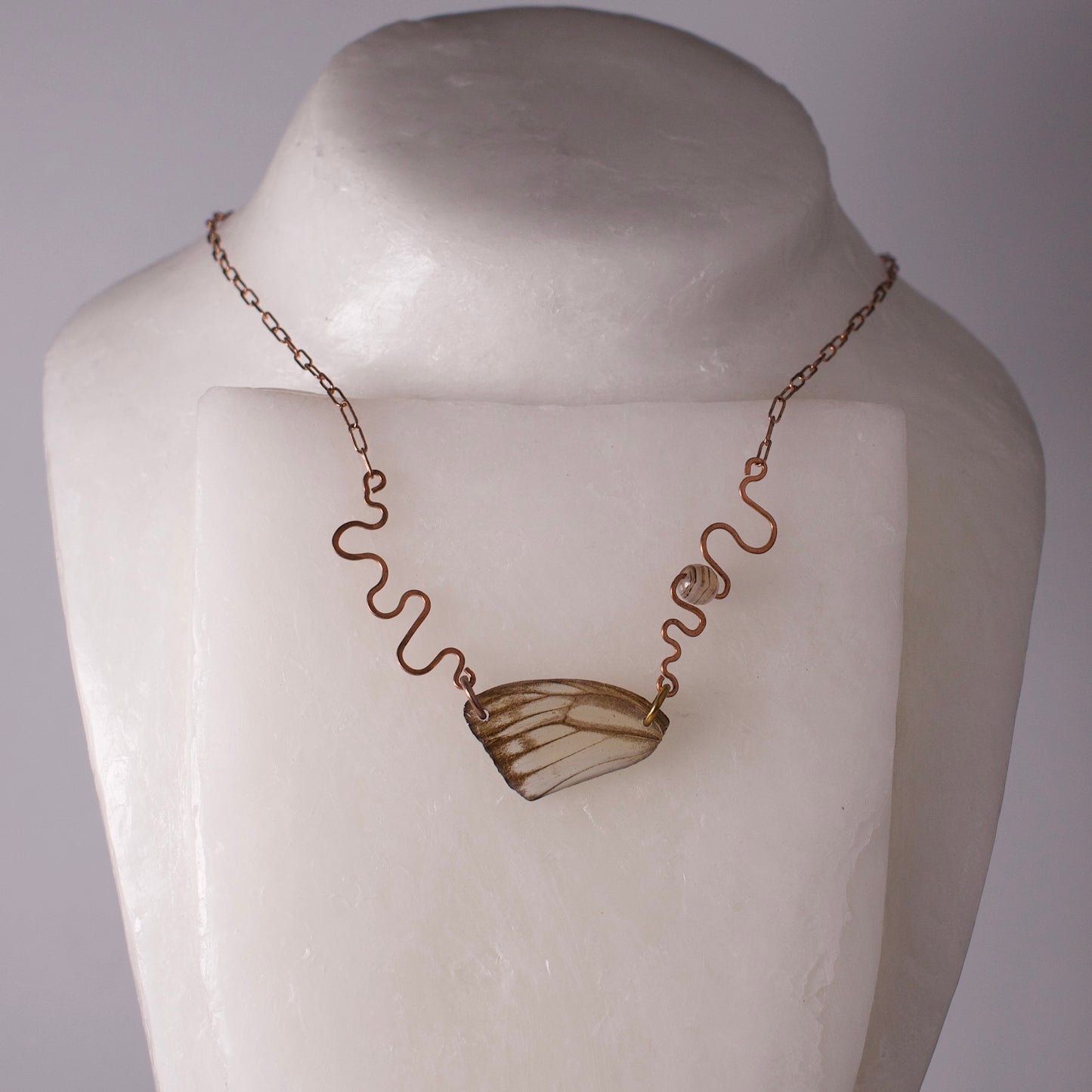 real butterfly wing necklace hand forged rose gold ivory striped albatross butterflies banded agate on mannequin