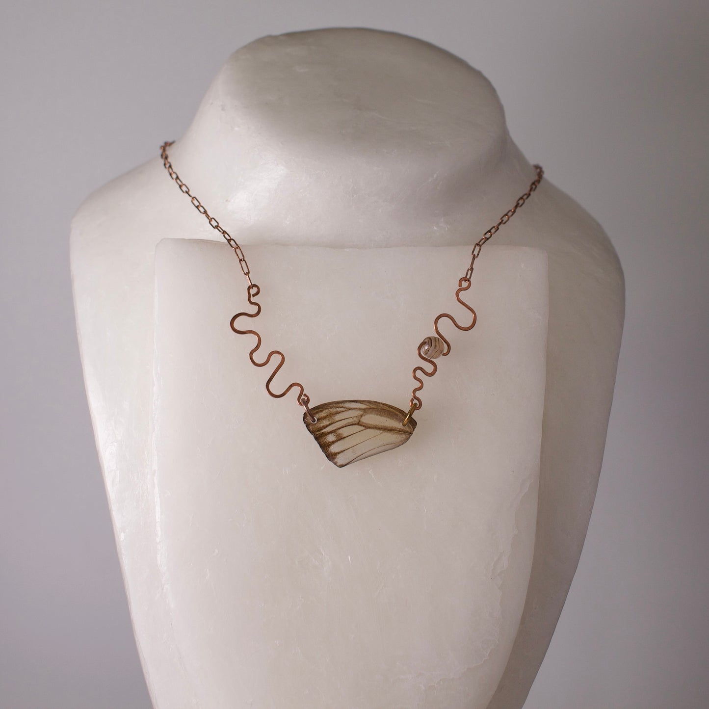 real butterfly wing necklace hand forged rose gold ivory striped albatross butterflies striped agate on wax form