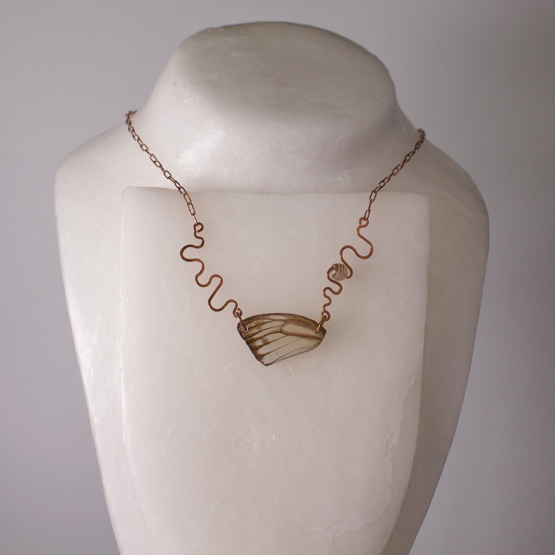 real butterfly wing necklace hand forged rose gold ivory striped albatross butterflies striped agate on wax form