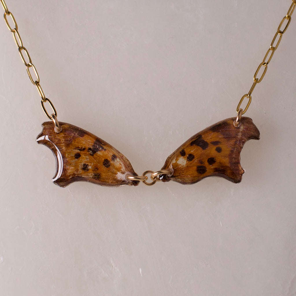 real butterfly wing necklace question mark butterflies 18k gold on steel paperclip chain close up on wax