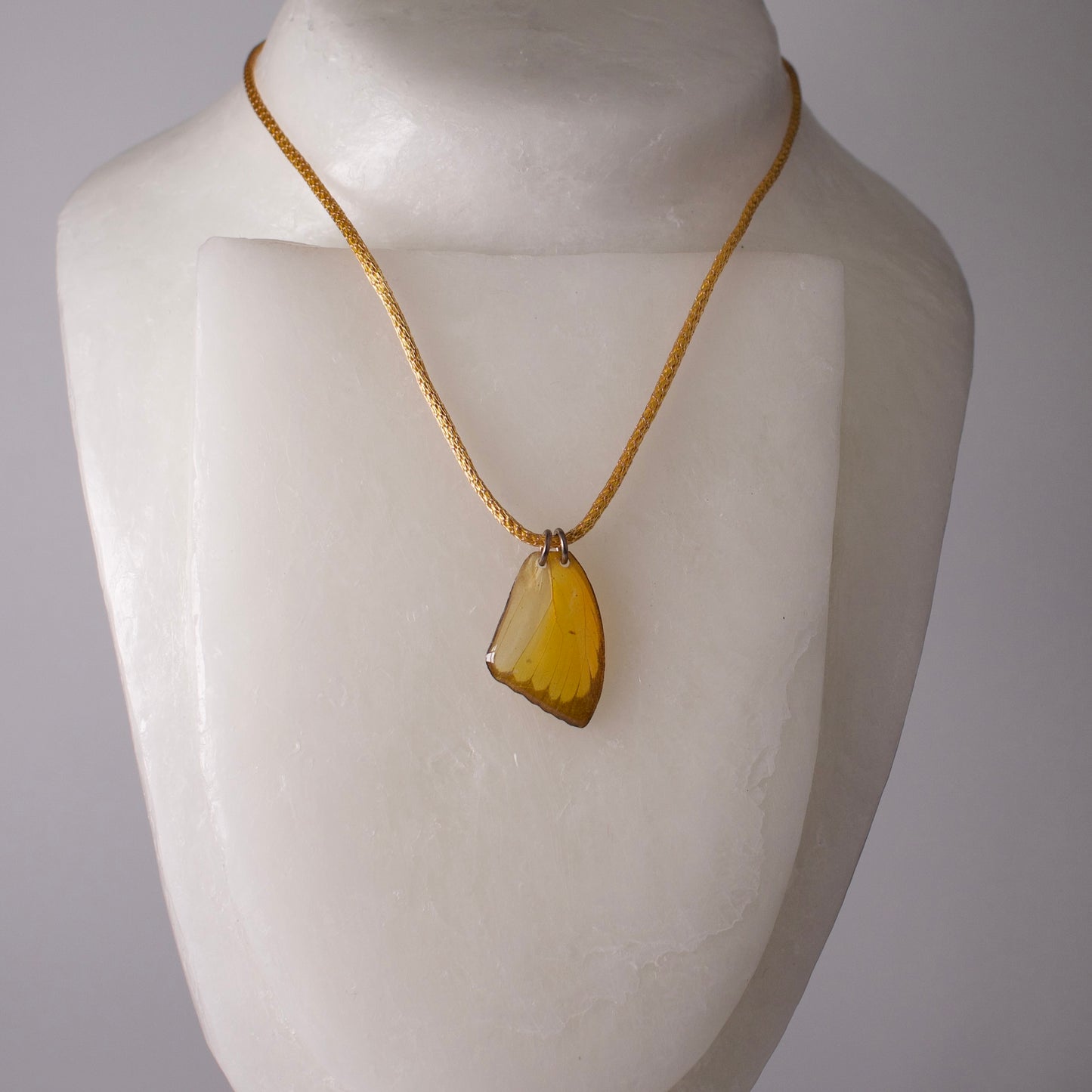 real butterfly wing pendant crocheted gold silver necklace yellow butterflies on mannequin