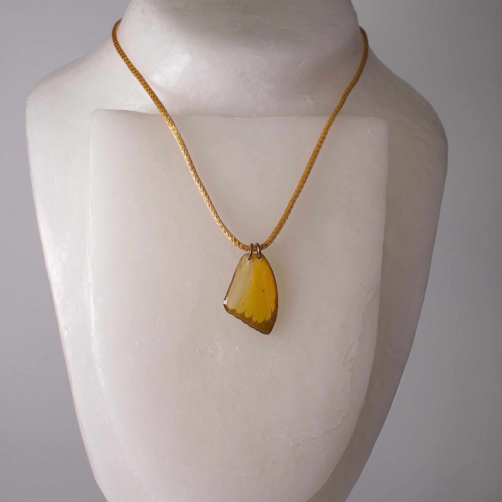 real butterfly wing pendant crocheted gold silver necklace yellow butterflies on mannequin