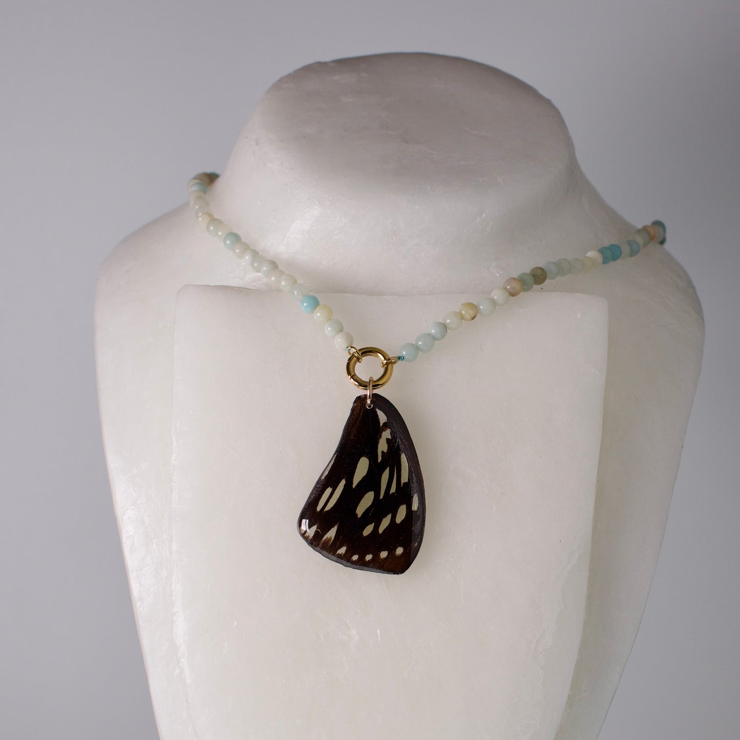 real butterfly wing pendant forest queen butterflies blue stone bead necklace gold front clasp on mannequin