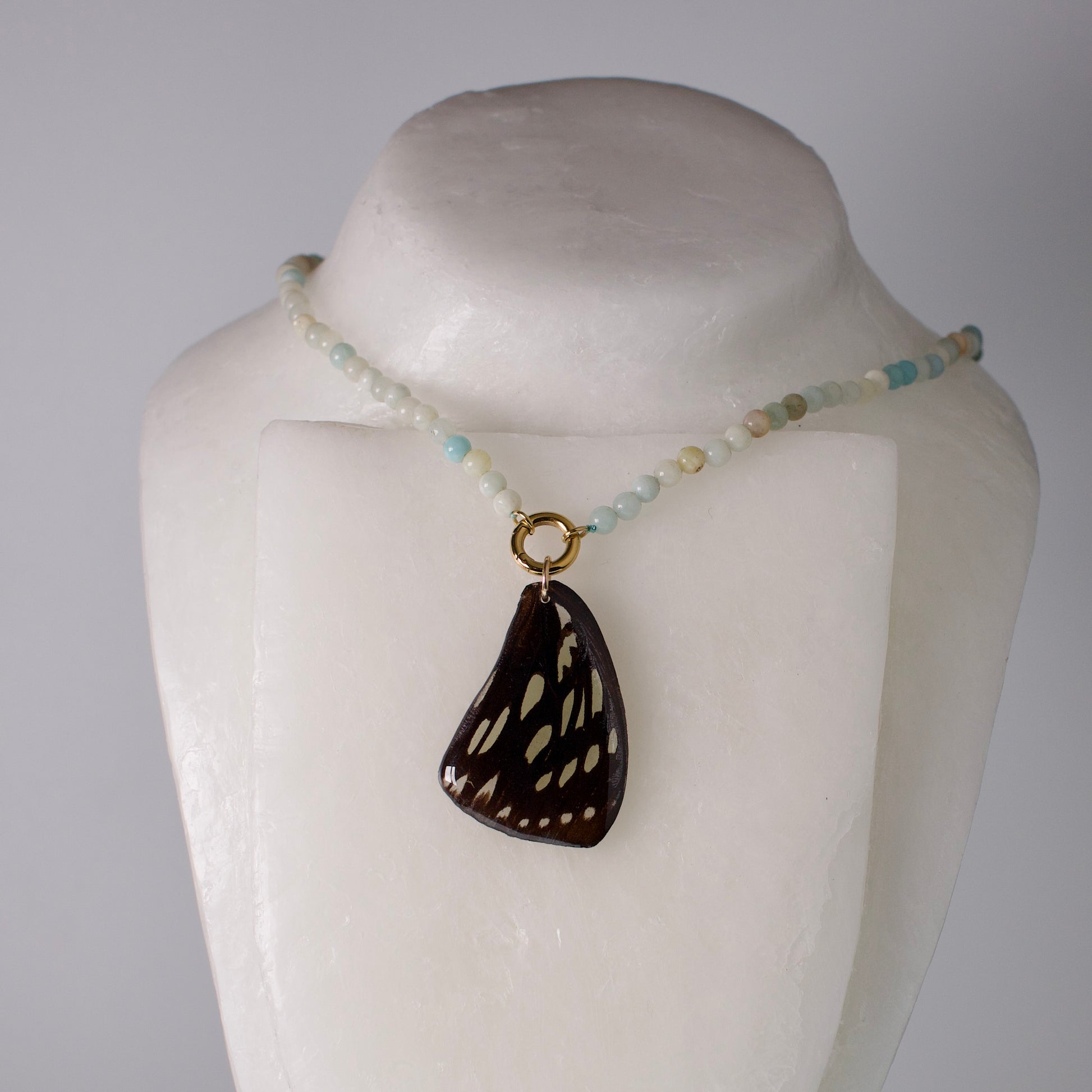 real butterfly wing pendant forest queen butterflies blue stone bead necklace gold front clasp on mannequin