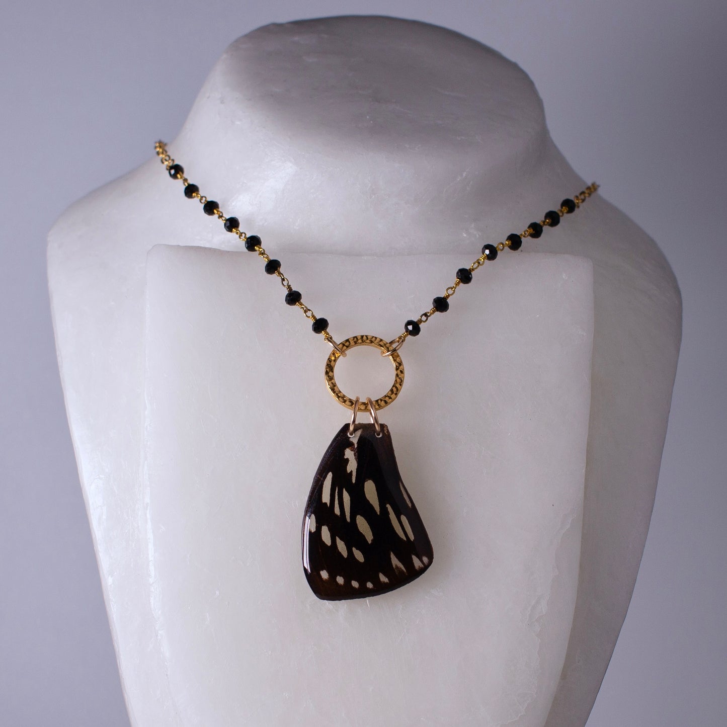real butterfly wing pendant gold necklace black onyx beading Euxanthe eurinome butterflies on mannequin