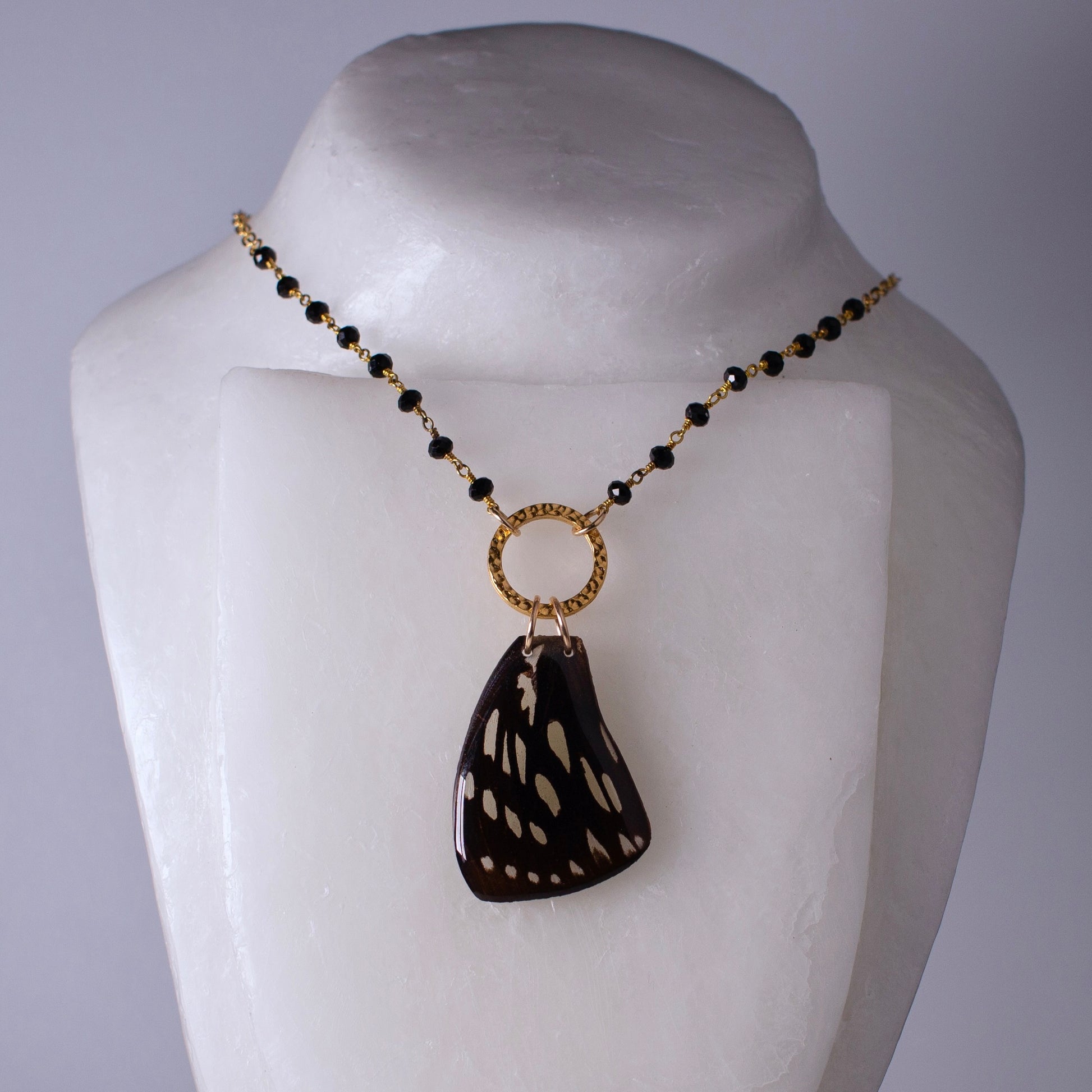 real butterfly wing pendant gold necklace black onyx beading Euxanthe eurinome butterflies on mannequin