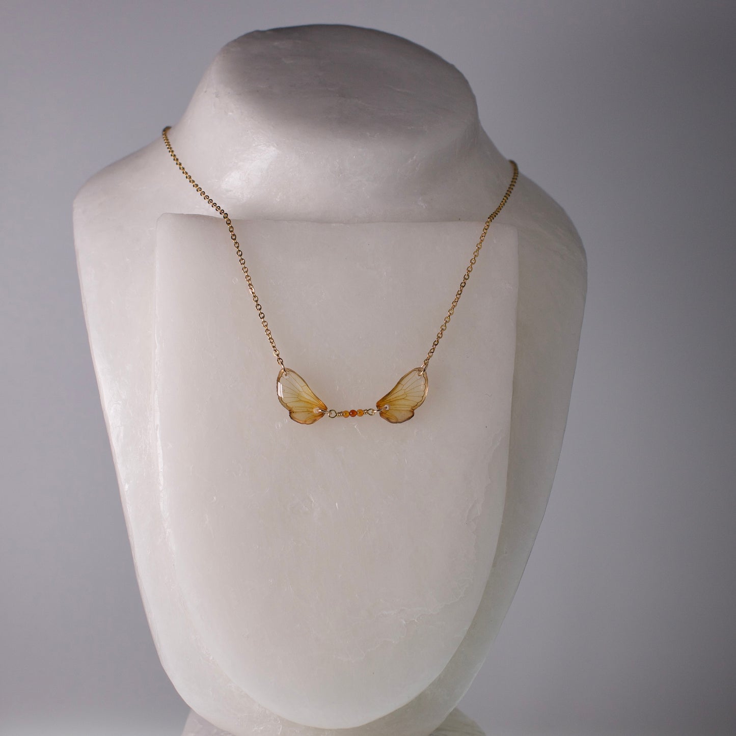 real cicada wing necklace Magicicada cassini Kansas Brood Cicadas fire agate gold chain on mannequin