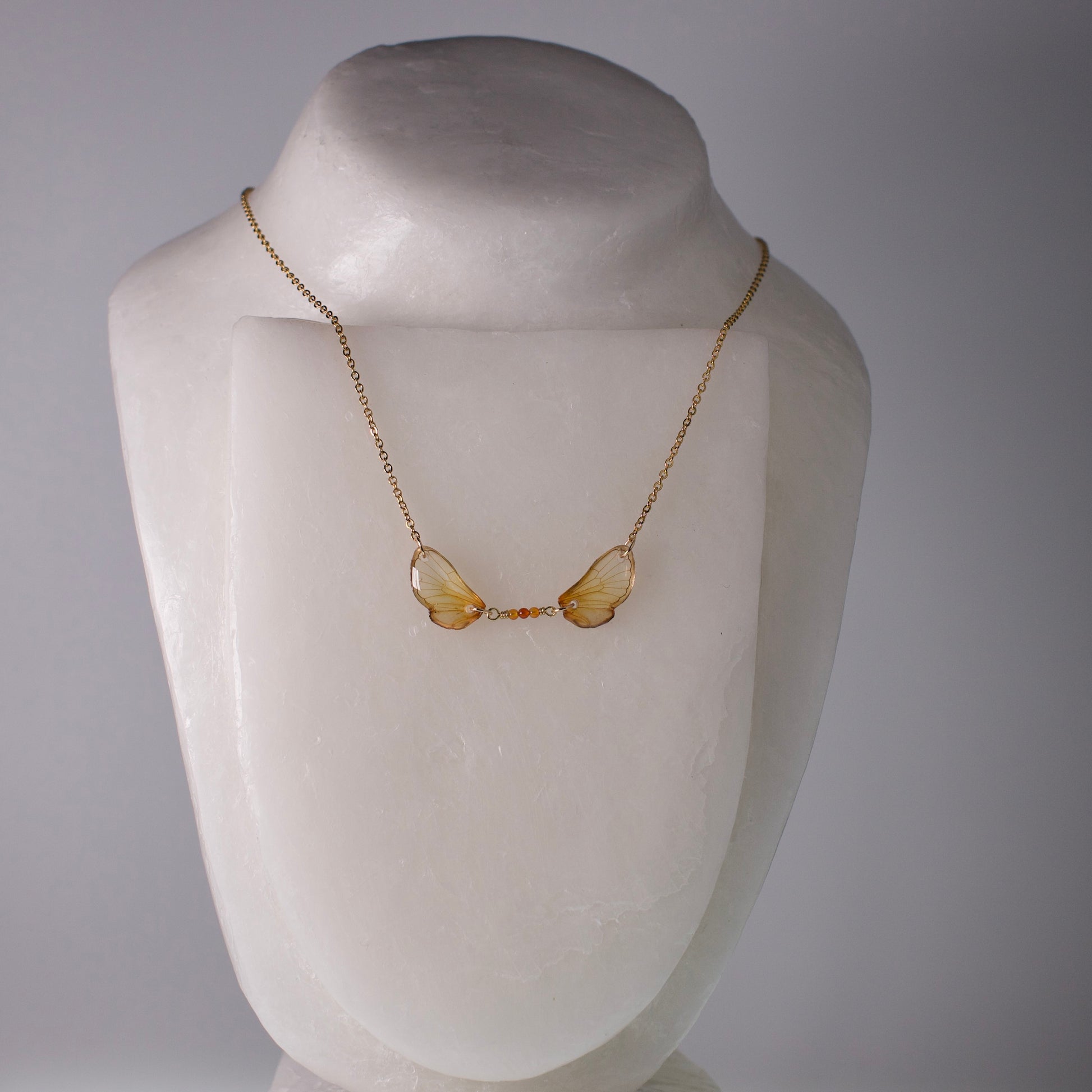 real cicada wing necklace Magicicada cassini Kansas Brood Cicadas fire agate gold chain on mannequin