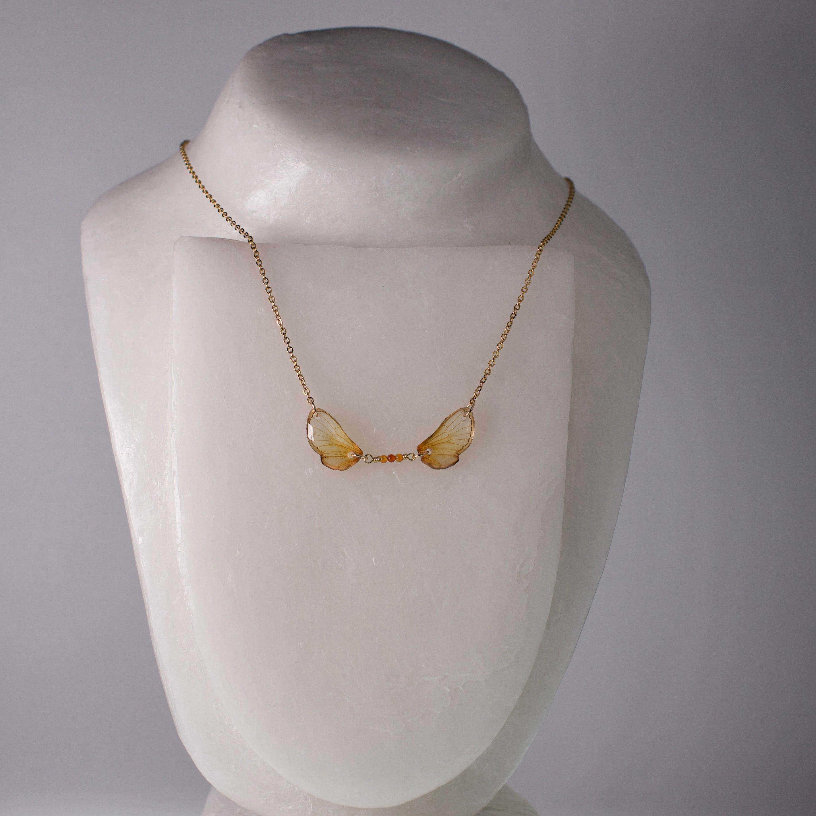 real cicada wing necklace Magicicada cassini Kansas Brood Cicadas fire agate gold chain on mannequin