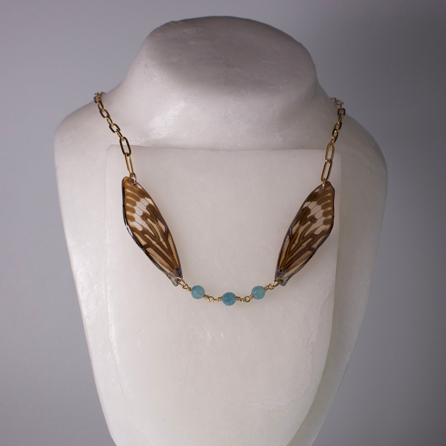 real ethically sourced cicada wing necklace gold chain apatite stones on mannequin