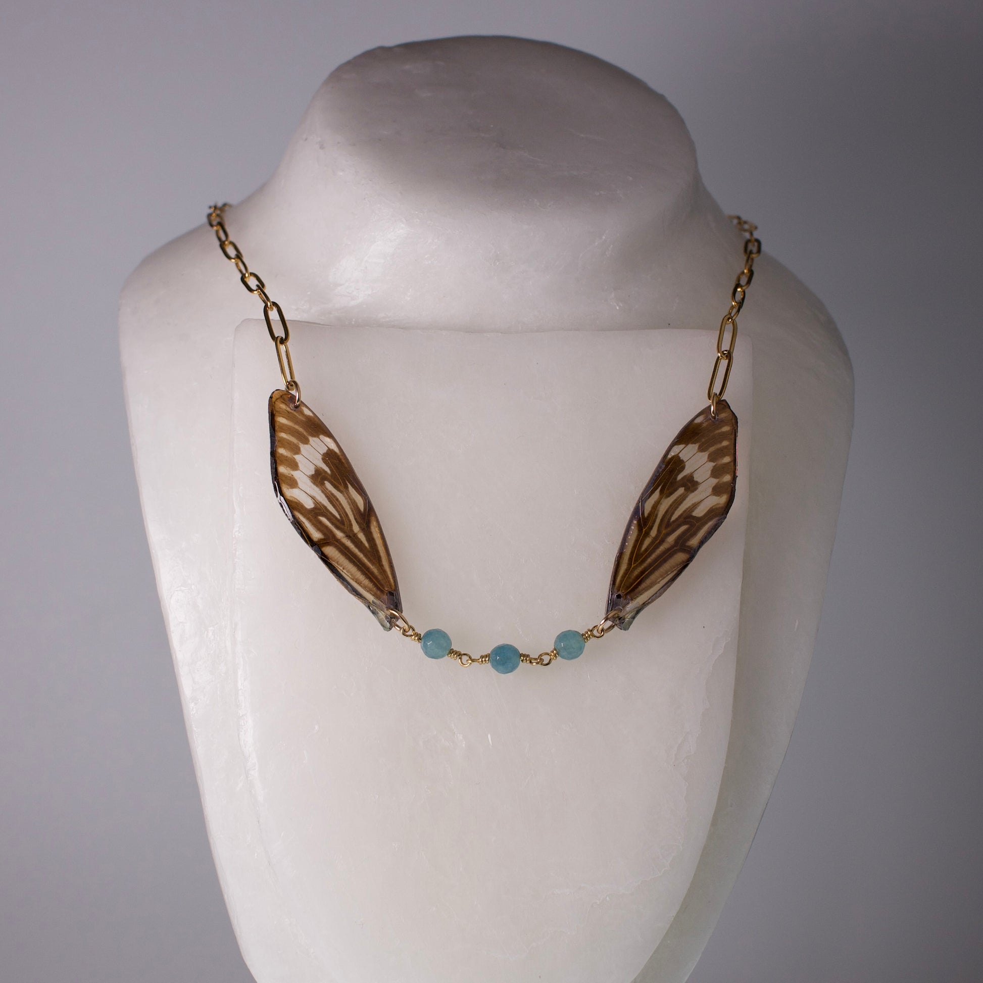 real ethically sourced cicada wing necklace gold chain apatite stones on mannequin