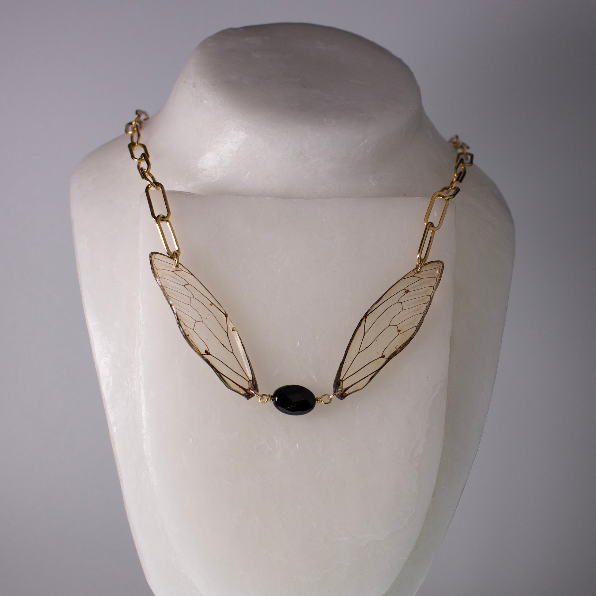 real cicada wing necklace gold paperclip chain giant cicadas gold sheen obsidian on mannequin