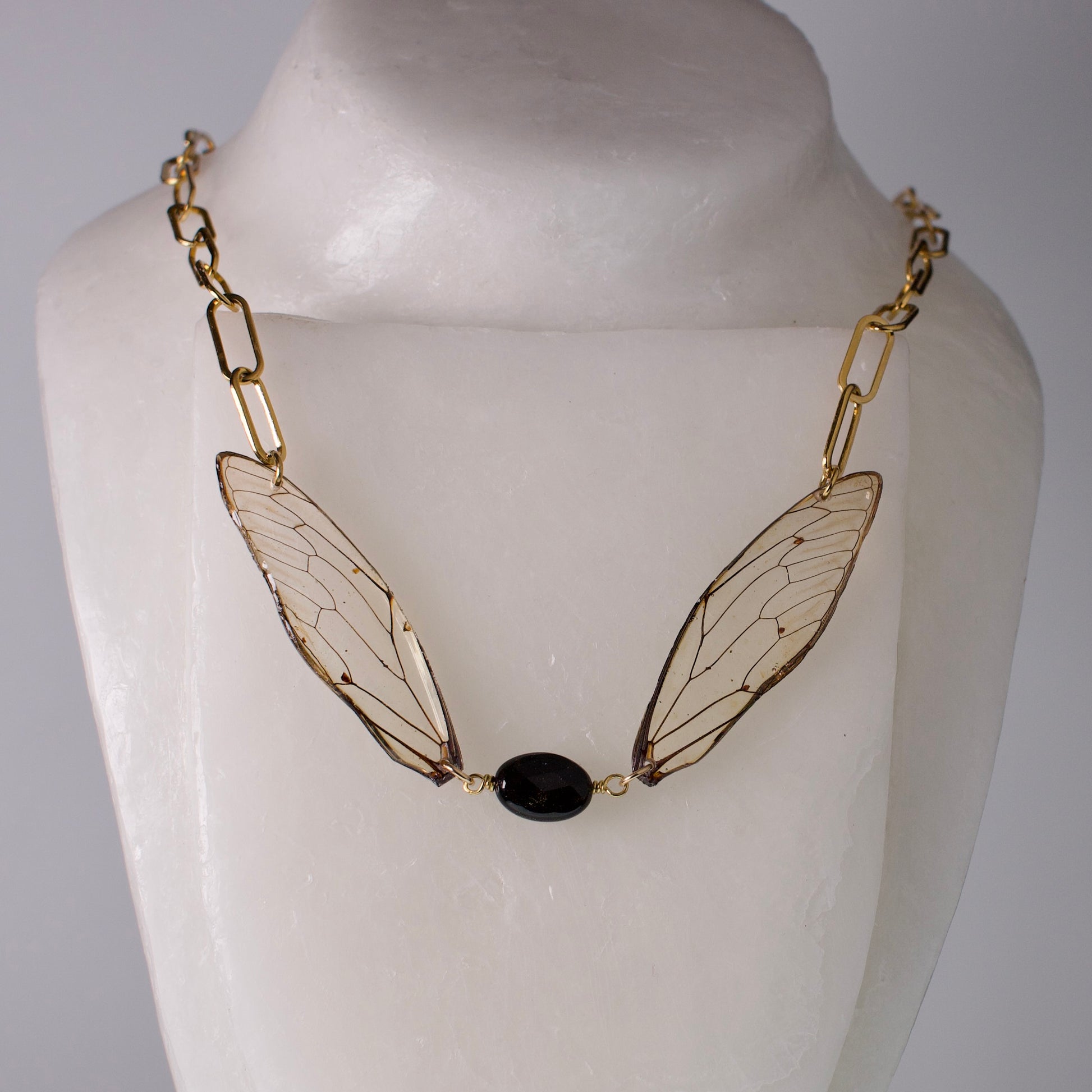 real cicada wing necklace gold paperclip chain gold sheen obsidian on mannequin