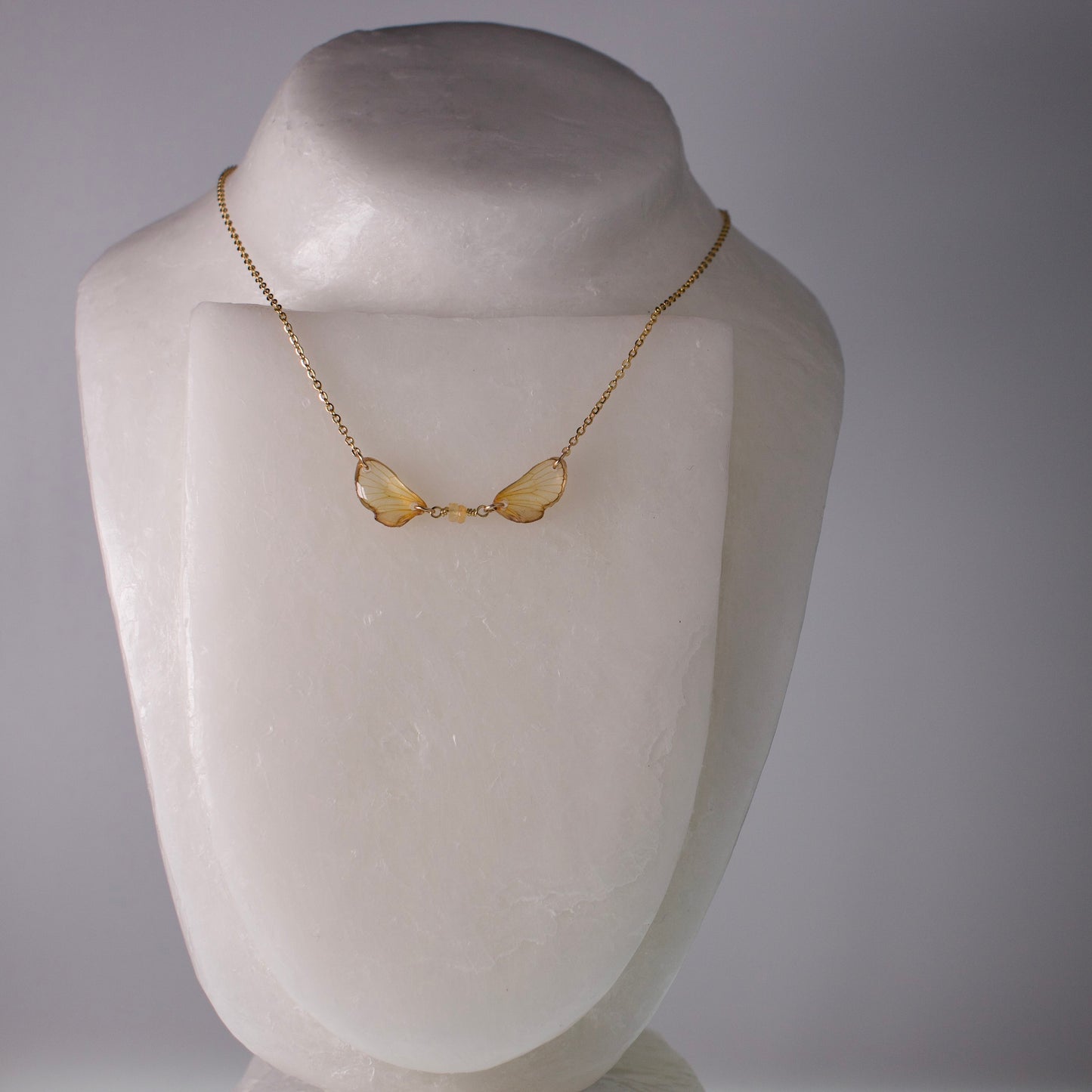 real cicada wing necklace sapphire tiny gold cicadas gold chain on mannequin