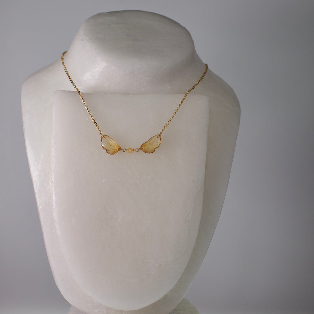 real cicada wing necklace tiny gold cicadas sapphire gold chain on mannequin
