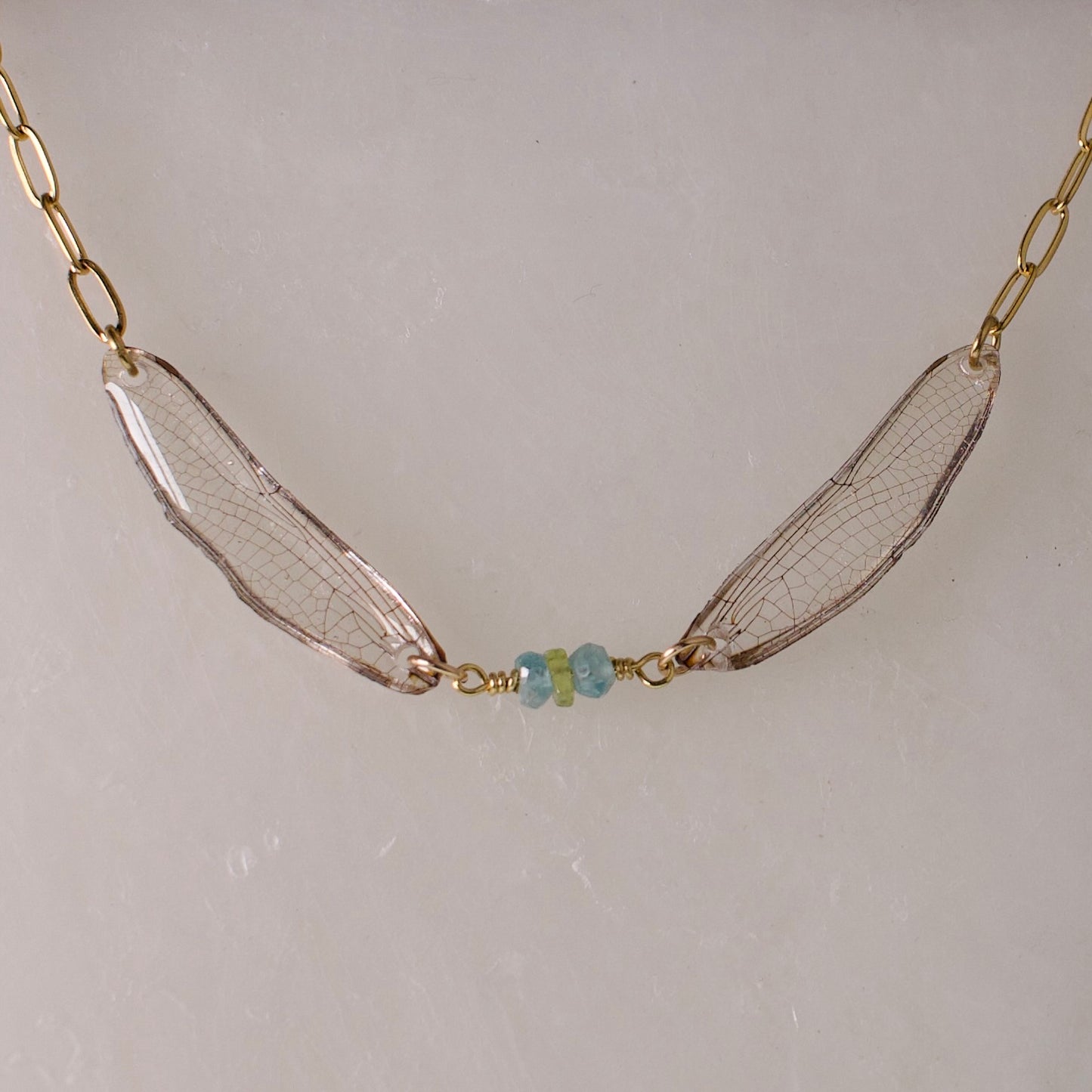 real dragonfly necklace gold paperclip chain green blue dragonflies peridot zircon close up