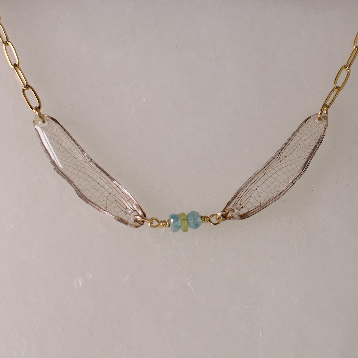 real dragonfly necklace gold paperclip chain green blue dragonflies peridot zircon close up